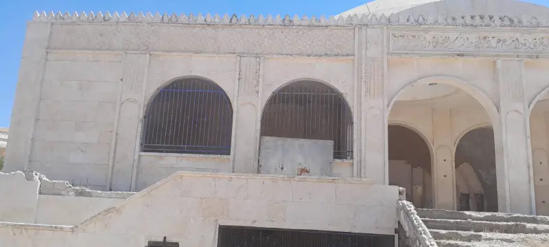 Window grilles and stone façade