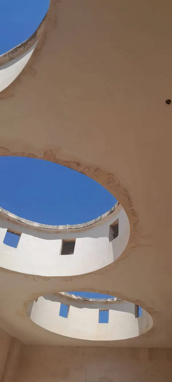 Circular skylights in the portico ceiling